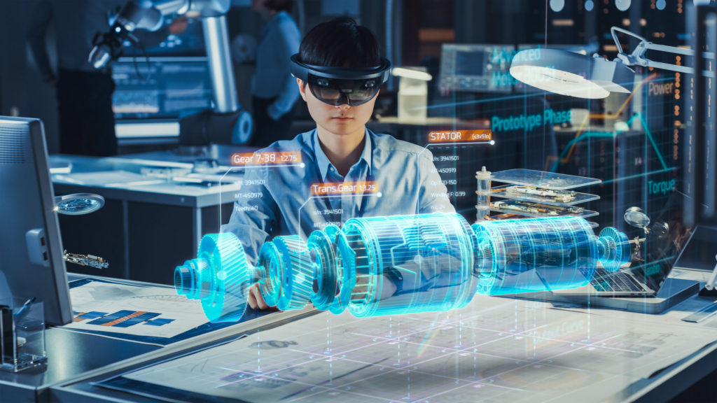 Industrial Factory Chief Engineer Wearing AR Headset Designs a Prototype of an Electric Motor on the Holographic Projection Blueprint. Futuristic Virtual Design of Mixed Technology Application.